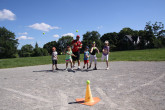 Children playing outdoor baseball.