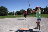 Children playing outdoor baseball.
