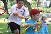 Sportball coach encouraging kids during Sportball multi-sport class.